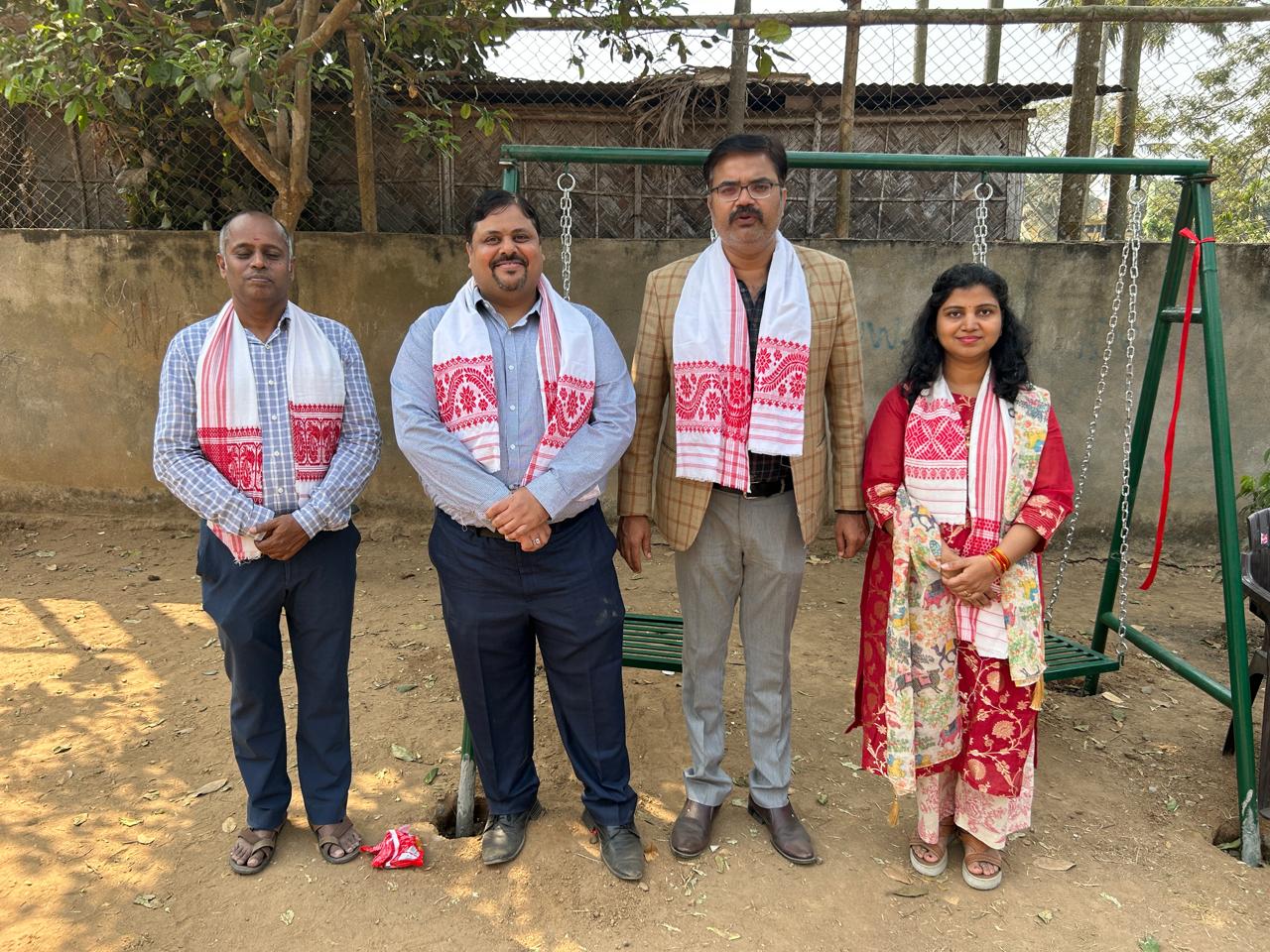 Nalvinai Trust representatives beside the donated swing